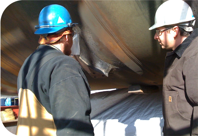 MinFab construction workers inspecting their work. MinFab construction workers inspecting their work.